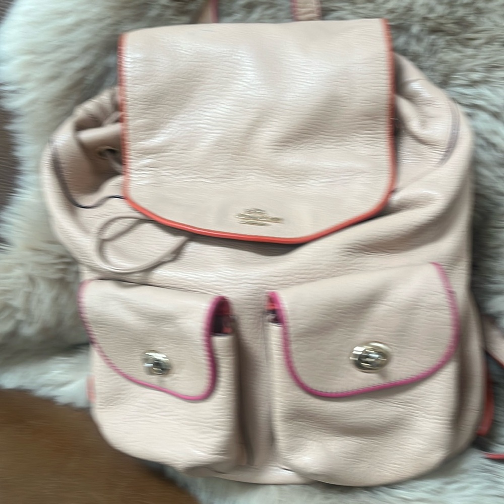 Coach backpack purse, good condition. Pale pink with orange siding.